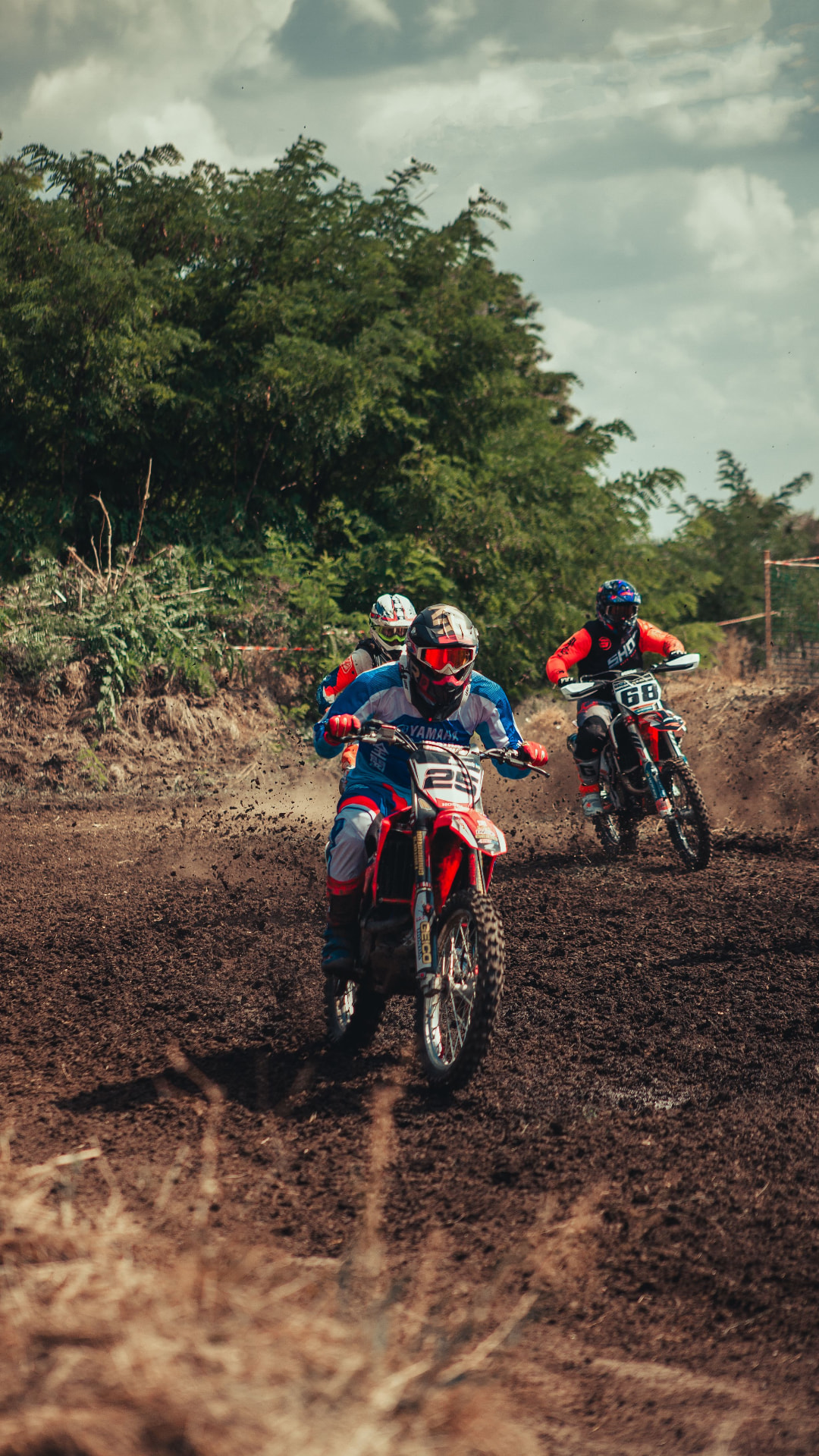 Motocross riders racing on a dirt track